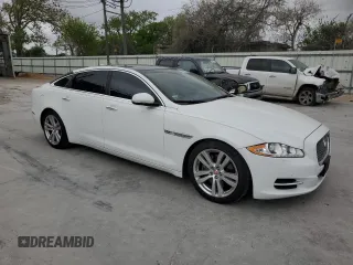 2014 Jaguar XJ Portfolio with VIN SAJWJ2GD6E8V65987, listed as a Copart auction lot 50091105 with 136,080 mi miles and Clean title. Bid and sale history available at DreamBid. Image 4.