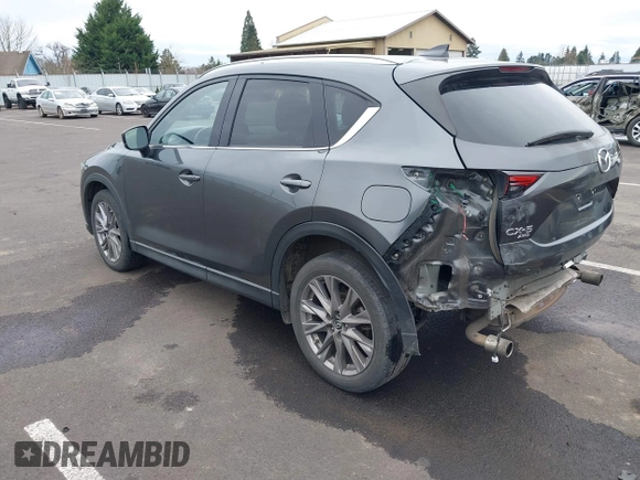 2020 Mazda CX-5 Grand Touring with VIN JM3KFBDM4L0829861, listed as a IAAI auction lot 41826250 with 62,091 mi miles and . Bid and sale history available at carsss.com. Image 3.