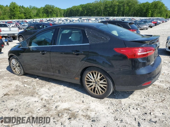 2015 Ford Focus Titanium with VIN 1FADP3J2XFL200489, listed as a Copart auction lot 56443215 with 139,990 mi miles and Clean title. Bid and sale history available at DreamBid. Image 2.