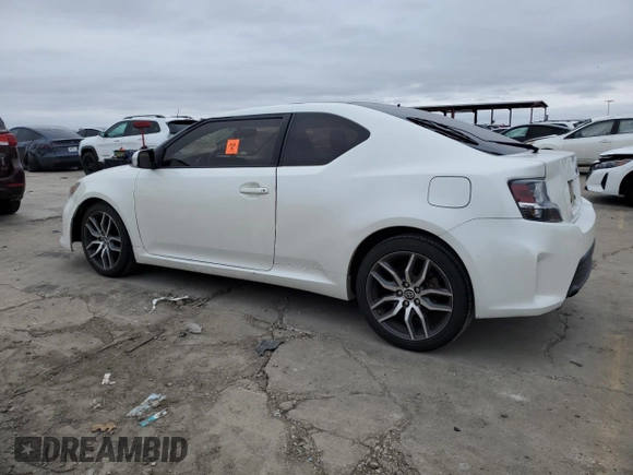 2016 Scion tC with VIN JTKJF5C73GJ019812, listed as a Copart auction lot 84228844 with 153,692 mi miles and Salvage Title. Bid and sale history available at carsss.com. Image 2.