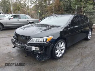 2014 Acura RLX with VIN JH4KC1F38EC002414, listed as a IAAI auction lot 41471421 with 112,853 mi miles. Bid and sale history available at carsss.com. Image 2.