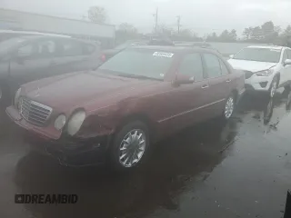 2002 Mercedes-Benz E 320 with VIN WDBJF82J22X070566, listed as a Copart auction lot 55964535 with 238,240 mi miles and Salvage Title. Bid and sale history available at DreamBid. Image 1.
