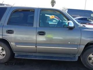 2002 Chevrolet Tahoe LS z VIN 1GNEC13V92R305304, wystawiony jako IAAI lot #41851210 z przebiegiem Nie podano mil oraz . Historia ofert i sprzedaży dostępna na DreamBid. Obrazek 13.
