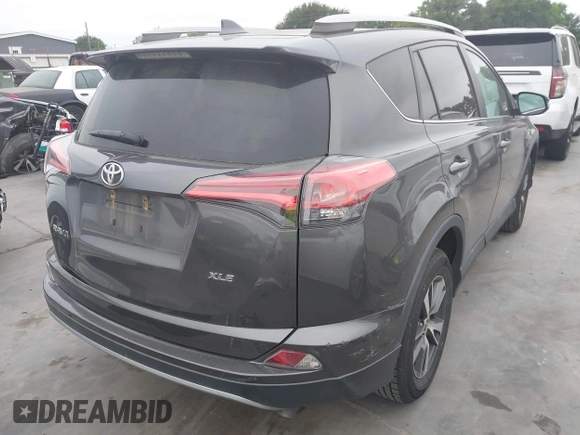 2018 Toyota RAV4 XLE with VIN 2T3WFREV1JW512476, listed as a IAAI auction lot 42177733 with 132,207 mi miles and . Bid and sale history available at DreamBid. Image 4.