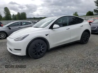 2023 Tesla Model Y Long Range z VIN 7SAYGDEE3PF751019, wystawiony jako Copart lot #57972885 z przebiegiem 24 591 mil mil oraz Szkoda całkowita • Salvage title. Historia ofert i sprzedaży dostępna na DreamBid. Obrazek 1.