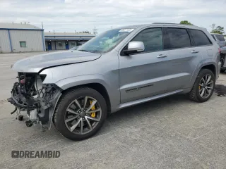 2018 Jeep Grand Cherokee Trackhawk with VIN 1C4RJFN91JC223825, listed as a Copart auction lot 58011465 with 83,177 mi miles and Salvage title. Bid and sale history available at DreamBid. Image 1.