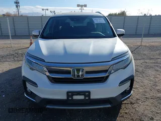 2022 Honda Pilot Touring 7-Passenger with VIN 5FNYF6H67NB017660, listed as a IAAI auction lot 41194603 with 87,301 mi miles. Bid and sale history available at carsss.com. Image 12.