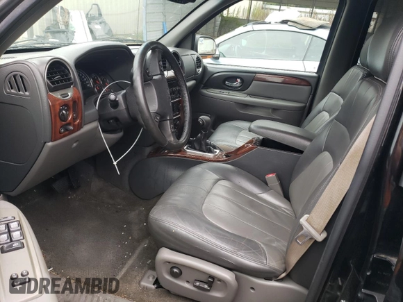 2004 GMC Envoy SLT with VIN 1GKDT13S942279670, listed as a Copart auction lot 73527974 with 120,425 mi miles and Salvage Title. Bid and sale history available at DreamBid. Image 7.