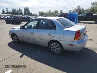 2005 Hyundai Accent GLS with VIN KMHCG45C55U623340, listed as a Copart auction lot 59587304 with 275,364 mi miles and Salvage Title. Bid and sale history available at carsss.com. Image 2.