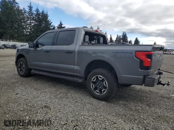 2023 Ford F-150 Lightning Pro with VIN 1FTVW1EL8PWG38419, listed as a Copart auction lot 47630535 with 11,940 mi miles and Salvage Title. Bid and sale history available at DreamBid. Image 2.