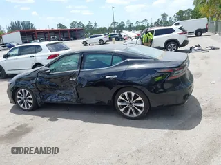 2023 Nissan Maxima Platinum z VIN 1N4AA6FV0PC502349, wystawiony jako IAAI lot #42114011 z przebiegiem 7 494 mil mil oraz . Historia ofert i sprzedaży dostępna na DreamBid. Obrazek 14.