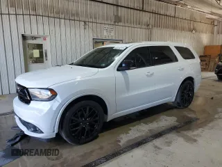 2015 Dodge Durango R/T with VIN 1C4SDJCT5FC180334, listed as a Copart auction lot 63310315 with 122,015 mi miles and Salvage title. Bid and sale history available at DreamBid. Image 1.