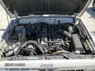 1996 Jeep Cherokee Sport with VIN 1J4FJ68S1TL128597, listed as a Copart auction lot 49600545 with 201,074 mi miles and Salvage title. Bid and sale history available at DreamBid. Image 12.