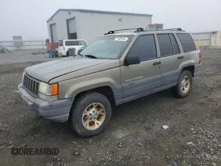1997 Jeep Grand Cherokee Laredo with VIN 1J4GZ58Y5VC637350, listed as a Copart auction lot 77405444 with 182,482 mi miles and Clean Title. Bid and sale history available at carsss.com. Image 1.