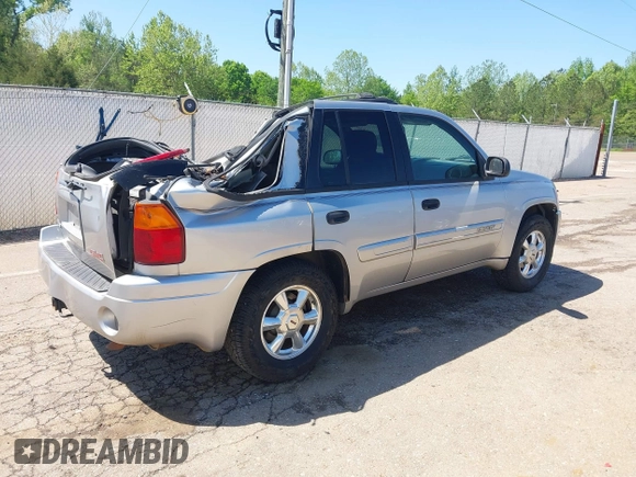 2004 GMC Envoy SLE with VIN 1GKDS13S242420100, listed as a IAAI auction lot 41963800 with 341,395 mi miles and . Bid and sale history available at DreamBid. Image 4.