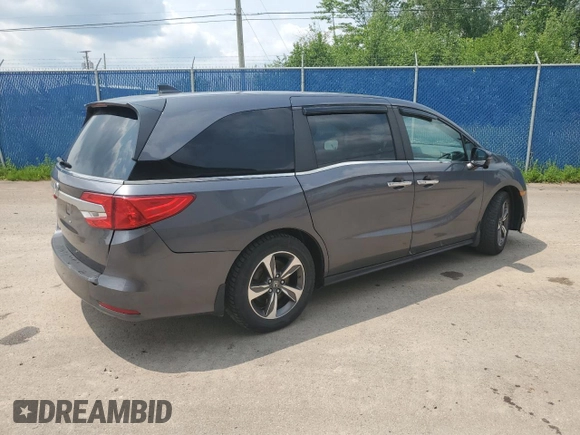 2018 Honda Odyssey with VIN 5FNRL6H49JB504977, listed as a Copart auction lot 60905615 with 180,464 mi miles and Clean title. Bid and sale history available at DreamBid. Image 3.