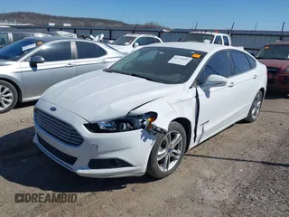 2016 Ford Fusion SE Hybrid with VIN 3FA6P0LU1GR127280, listed as a IAAI auction lot 41754682 with 194,357 mi miles. Bid and sale history available at carsss.com. Image 2.