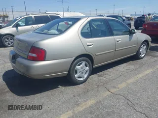 2000 Nissan Altima XE with VIN 1N4DL01D3YC197921, listed as a IAAI auction lot 41953585 with 84,233 mi miles. Bid and sale history available at carsss.com. Image 4.