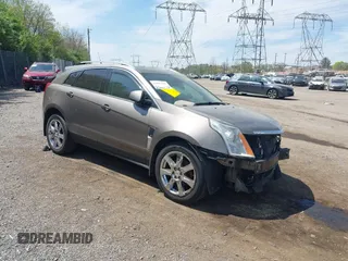 2011 Cadillac SRX Premium Collection z VIN 3GYFNFEY7BS519548, wystawiony jako IAAI lot #42097305 z przebiegiem 124 083 mil mil oraz . Historia ofert i sprzedaży dostępna na DreamBid. Obrazek 1.