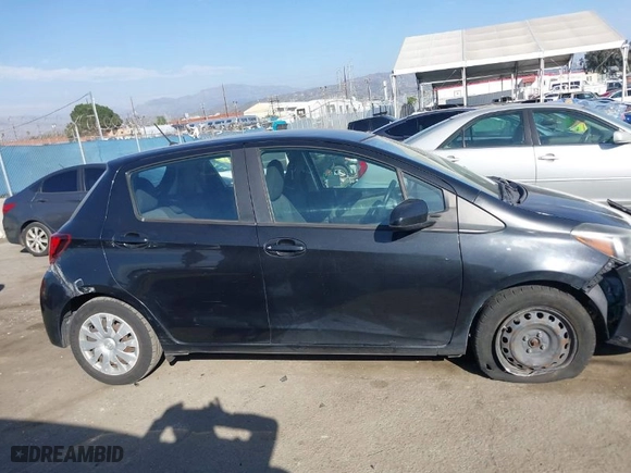 2015 Toyota Yaris L with VIN VNKKTUD34FA038840, listed as a IAAI auction lot 41700783 with 106,628 mi miles. Bid and sale history available at carsss.com. Image 14.