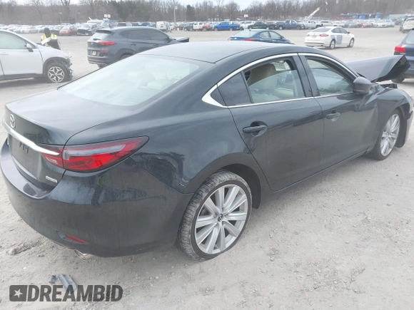 2021 Mazda Mazda6 Touring with VIN JM1GL1VM1M1604566, listed as a IAAI auction lot 41728787 with 68,636 mi miles. Bid and sale history available at carsss.com. Image 4.