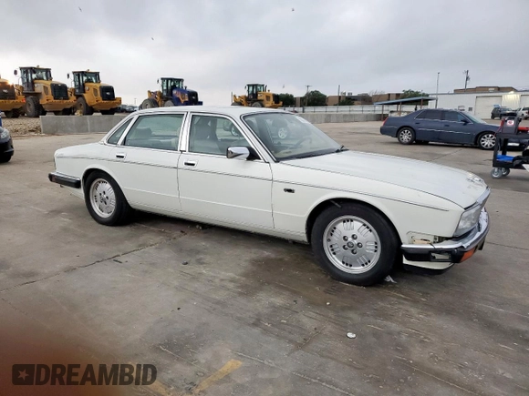 1994 Jaguar XJ with VIN SAJKX1743RC698636, listed as a Copart auction lot 56376685 with 192,928 mi miles and Salvage title. Bid and sale history available at DreamBid. Image 4.