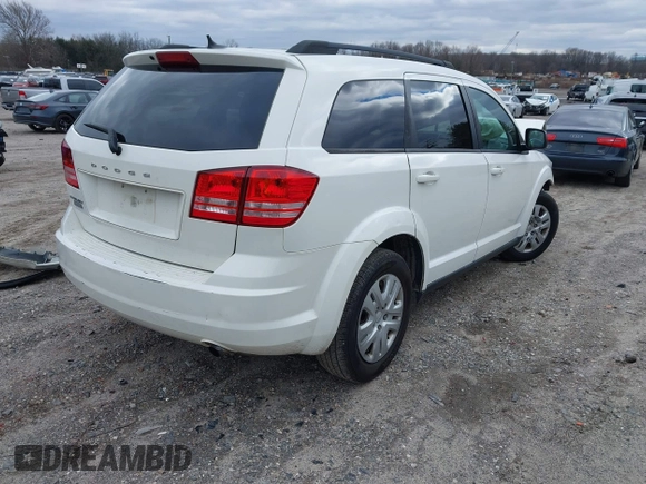 2016 Dodge Journey SE with VIN 3C4PDCAB1GT104630, listed as a IAAI auction lot 41731485 with 233,992 mi miles. Bid and sale history available at carsss.com. Image 4.