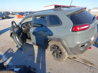 2015 Jeep Cherokee Trailhawk with VIN 1C4PJMBSXFW614416, listed as a IAAI auction lot 41033241 with 112,015 mi miles. Bid and sale history available at carsss.com. Image 3.