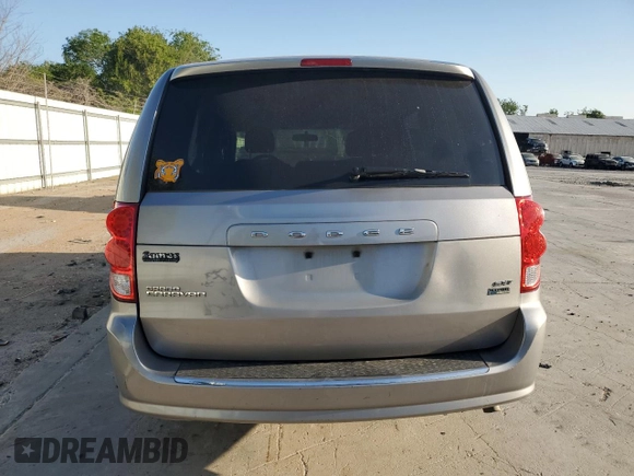 2014 Dodge Grand Caravan SXT with VIN 2C4RDGCG1ER121033, listed as a Copart auction lot 52030715 with 105,451 mi miles and Salvage Title. Bid and sale history available at DreamBid. Image 6.