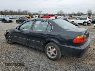 1999 Honda Civic LX with VIN 2HGEJ6677XH585273, listed as a Copart auction lot 51164635 with 184,874 mi miles and Salvage Title. Bid and sale history available at DreamBid. Image 2.