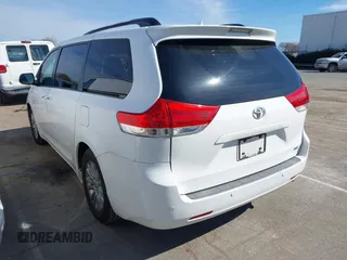 2011 Toyota Sienna XLE AAS with VIN 5TDYK3DCXBS043733, listed as a IAAI auction lot 41601544 with 221,658 mi miles and . Bid and sale history available at DreamBid. Image 3.