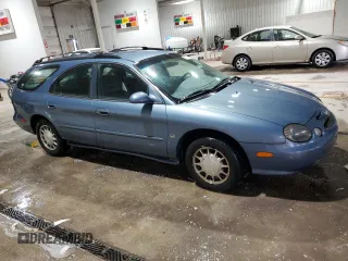 1999 Ford Taurus SE z VIN 1FAFP58S0XG301691, wystawiony jako Copart lot #81920424 z przebiegiem 203 931 mil mil oraz Szkoda całkowita • Salvage title. Historia ofert i sprzedaży dostępna na DreamBid. Obrazek 4.