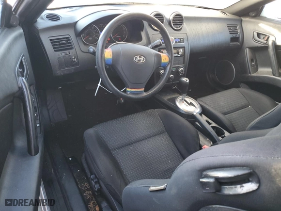 2007 Hyundai Tiburon GS with VIN KMHHM66D97U255247, listed as a Copart auction lot 88322895 with 144,113 mi miles and Salvage Title. Bid and sale history available at carsss.com. Image 8.