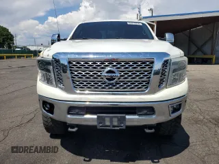 2016 Nissan Titan Platinum Reserve z VIN 1N6BA1F41GN504539, wystawiony jako Copart lot #64812975 z przebiegiem 143 144 mil mil oraz Szkoda całkowita • Salvage title. Historia ofert i sprzedaży dostępna na DreamBid. Obrazek 5.