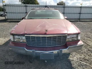 1994 Cadillac Fleetwood z VIN 1G6DW52P8RR719354, wystawiony jako Copart lot #77161044 z przebiegiem 154 480 mil mil oraz Tytuł czysty. Historia ofert i sprzedaży dostępna na DreamBid. Obrazek 5.