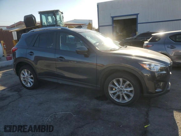 2014 Mazda CX-5 Grand Touring with VIN JM3KE4DY1E0328852, listed as a Copart auction lot 53965265 with 67,242 mi miles and Salvage Title. Bid and sale history available at DreamBid. Image 4.