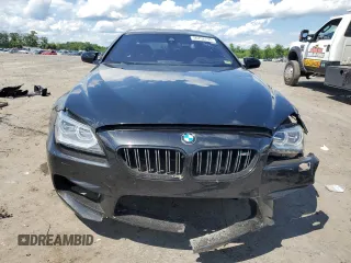 2015 BMW M6 z VIN WBS6C9C50FD467779, wystawiony jako Copart lot #56702794 z przebiegiem 78 259 mil mil oraz Szkody całkowita. Historia ofert i sprzedaży dostępna na DreamBid. Obrazek 5.