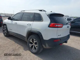 2015 Jeep Cherokee Trailhawk with VIN 1C4PJMBS6FW687718, listed as a IAAI auction lot 42505169 with 122,526 mi miles and . Bid and sale history available at DreamBid. Image 3.