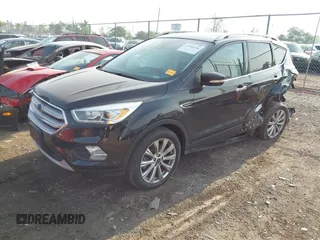 2018 Ford Escape Titanium with VIN 1FMCU9J95JUB30803, listed as a IAAI auction lot 42286536 with 63,309 mi miles and . Bid and sale history available at DreamBid. Image 18.