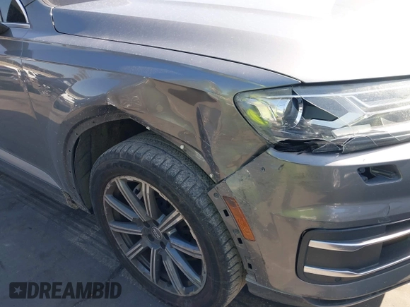 2017 Audi Q7 Premium with VIN WA1AAAF71HD010675, listed as a IAAI auction lot 41956959 with 136,549 mi miles and . Bid and sale history available at DreamBid. Image 6.