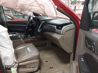 2015 Chevrolet Suburban LTZ z VIN 1GNSKKKC7FR218034, wystawiony jako IAAI lot #41884644 z przebiegiem 160 721 mil mil oraz . Historia ofert i sprzedaży dostępna na DreamBid. Obrazek 5.