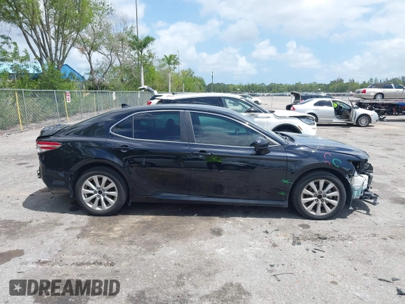 2020 Toyota Camry LE with VIN 4T1C11AK1LU986972, listed as a IAAI auction lot 41966639 with 97,617 mi miles and . Bid and sale history available at carsss.com. Image 12.