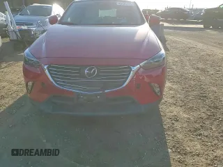2018 Mazda CX-3 Grand Touring z VIN JM1DKFD79J0313779, wystawiony jako Copart lot #49120125 z przebiegiem 40 703 mil mil oraz Szkody całkowita. Historia ofert i sprzedaży dostępna na DreamBid. Obrazek 11.