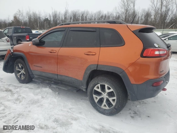 2015 Jeep Cherokee Trailhawk with VIN 1C4PJMBS9FW500763, listed as a Copart auction lot 82999324 with 84,924 mi miles and Salvage Title. Bid and sale history available at carsss.com. Image 2.