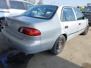 2000 Toyota Corolla VE with VIN 1NXBR12E6YZ393077, listed as a IAAI auction lot 42111914 with 181,056 mi miles and . Bid and sale history available at DreamBid. Image 4.