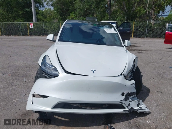 2022 Tesla Model Y Long Range with VIN 7SAYGDEE0NF423327, listed as a IAAI auction lot 41941114 with 29,559 mi miles and . Bid and sale history available at carsss.com. Image 13.