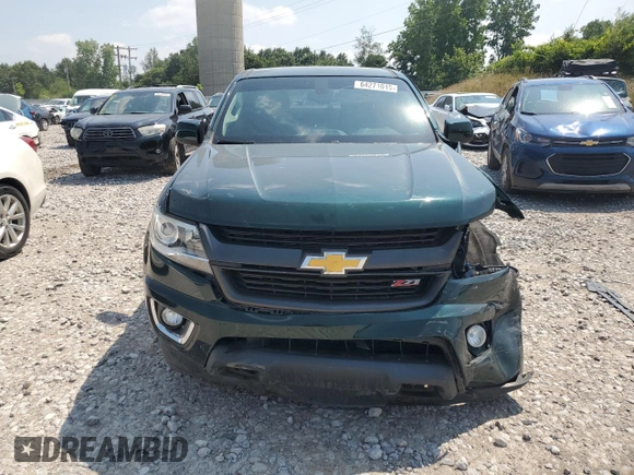 2015 Chevrolet Colorado 4WD Z71 with VIN 1GCGTCE35F1149677, listed as a Copart auction lot 64271015 with 39,671 mi miles and Clean title. Bid and sale history available at DreamBid. Image 5.