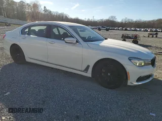 2017 BMW 7 Series 740i with VIN WBA7E2C32HG740649, listed as a Copart auction lot 45593145 with 122,793 mi miles and Salvage Title. Bid and sale history available at carsss.com. Image 4.
