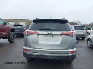 2018 Toyota RAV4 LE with VIN 2T3BFREVXJW717079, listed as a IAAI auction lot 42001580 with 96,044 mi miles. Bid and sale history available at carsss.com. Image 16.