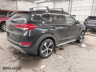 2018 Hyundai Tucson Value with VIN KM8J3CA28JU648236, listed as a IAAI auction lot 41161221 with 104,057 mi miles. Bid and sale history available at carsss.com. Image 4.